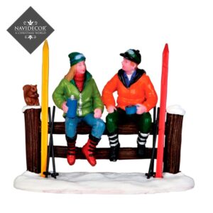 Esquiadores sentados**